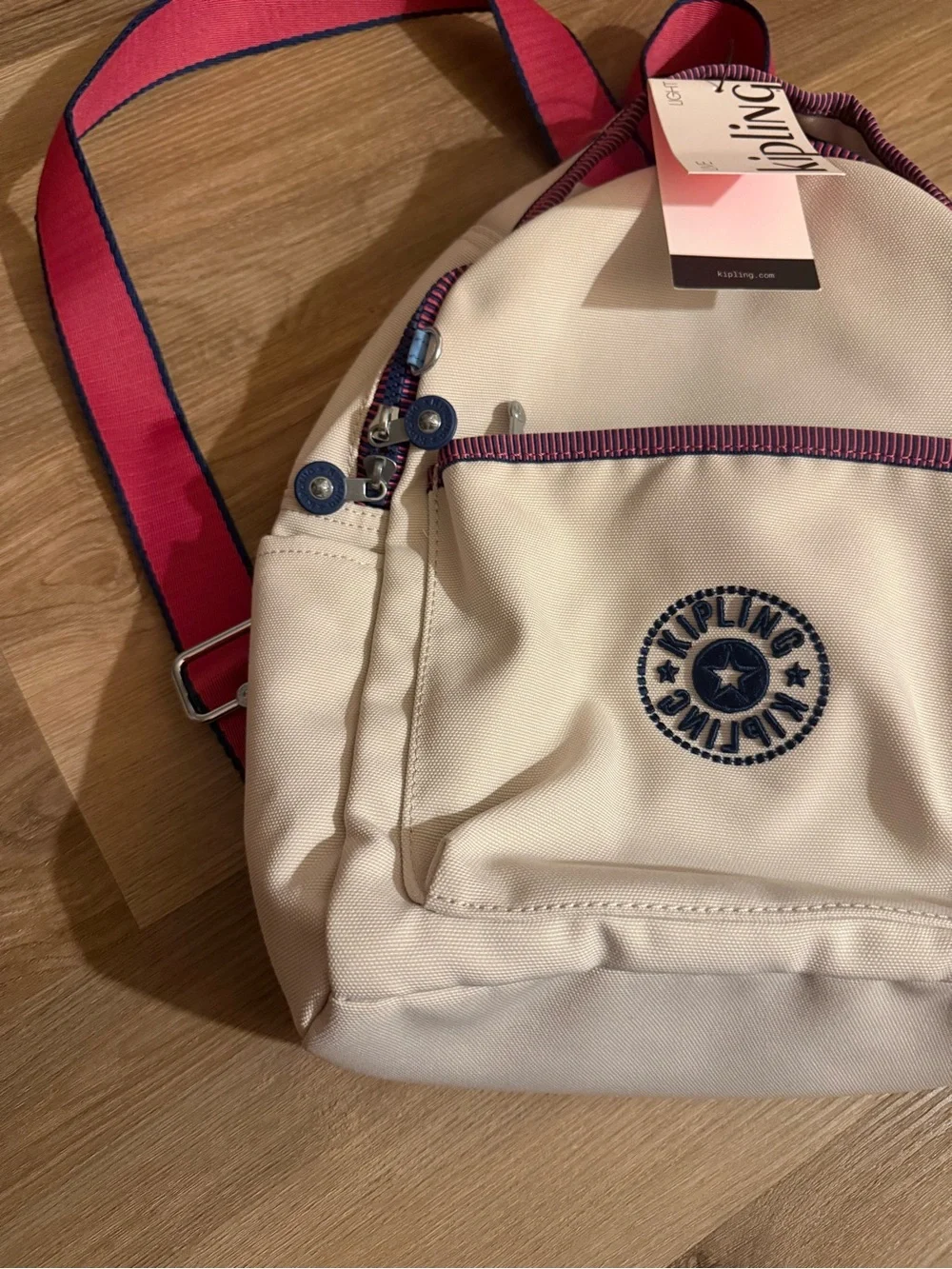Kipling Cream Kids Backpack with Purple Trim and Blue Charm